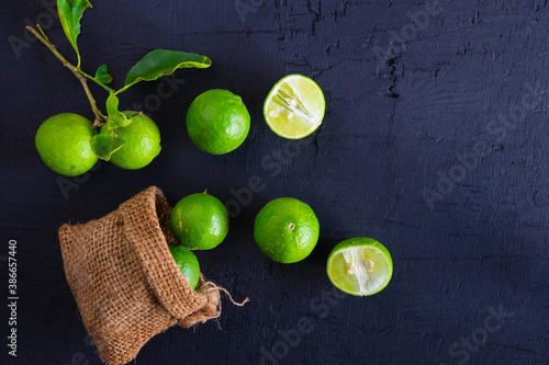 Fresh Limes  on a black background photo