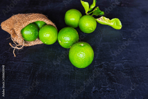 Fresh Limes  on a black background photo