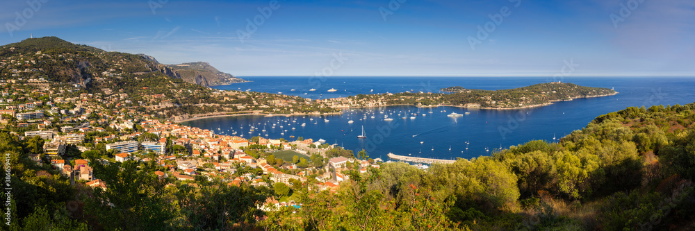 Villefranche-sur-Mer, Saint-Jean-Cap-Ferrat and the Espalmador Bay with yachts and tourist boats in summer (panoramic). Cote d'Azur, French Riviera, Alpes Maritimes, PACA Region, France