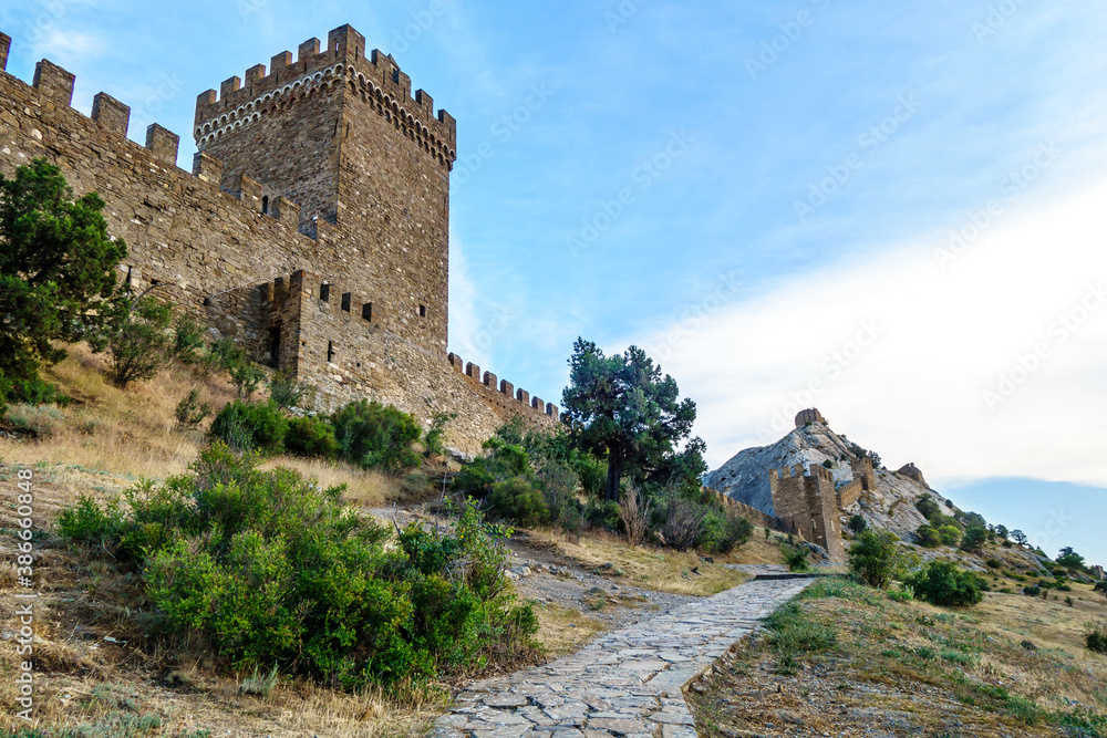 Fortification line of medieval Genoese fortress, Sudak, Crimea. Built on almost unattackable rock (more 500 ft height). Tower on foreground named Consul, others named after St. George & St. Elijah