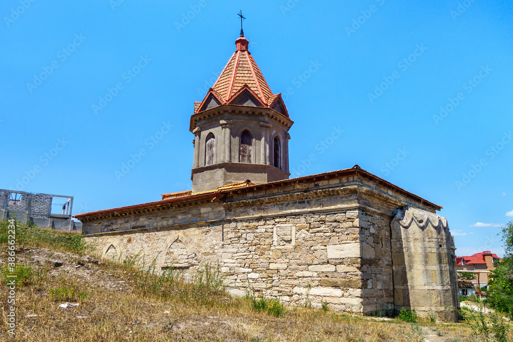 Armenian church of Saint George, Feodosia, Crimea. Ground level is higher than one of its sides, so it seems to be church is growing up from hill