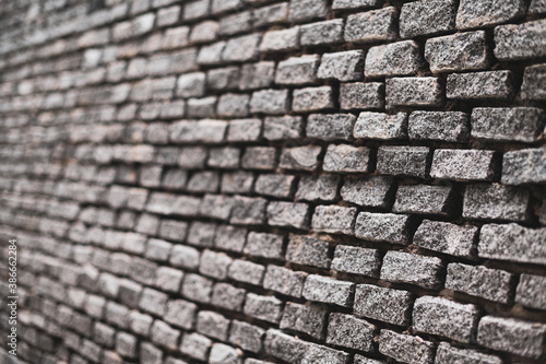 Shallow depth of field with Old vintage brick wall. Abstract architectural loft background for design.