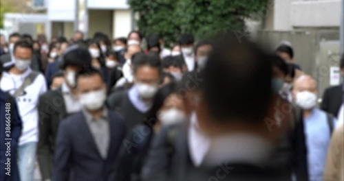Commuters with face masks walking to work in Tokyo, JAPAN (コロナ禍の東京の通勤風景) / 4K photo