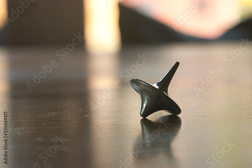 Steel metal inception spinner on table