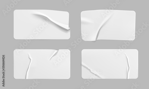 White glued crumpled rectangle stickers mock up set. Blank white adhesive paper or plastic sticker label with wrinkled and creased effect. Template label tags close up. 3d realistic vector