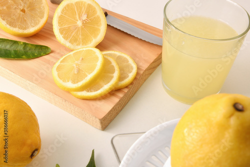 Sliced and squeezed lemon on white table © Davizro Photography