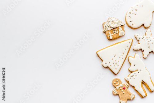 Food pattern with icing gingerbread cookies for Christmas, overhead view