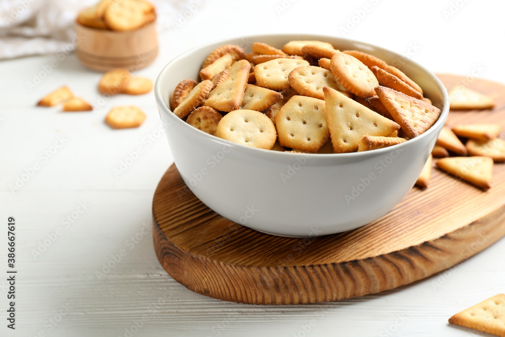 Delicious crispy crackers on white table, closeup Delicious crispy crackers on white table, closeup