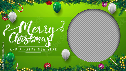 Merry Christmas and Happy New Year, green template of greeting postcard with frame of Christmas tree branches, garland, balloons and beautiful greeting lettering photo