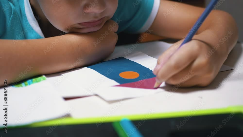 Hand Child Draws with Colored Pencils at Home. Home Schooling, Education Concept Hand Child Draws with Colored Pencils at Home. Home Schooling, Education Concept