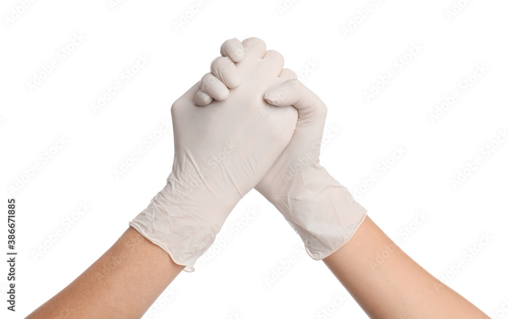 Doctors in medical gloves shaking hands on white background, closeup Doctors in medical gloves shaking hands on white background, closeup