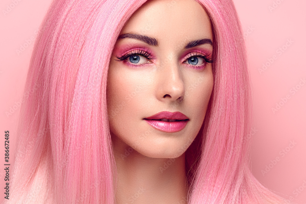 Beauty Fashion woman with Colorful Pink Dyed Hair. Girl with blue eyes, perfect Makeup and Hairstyle. Beautiful smiling model portrait, fashionable pink make up, hair. Skincare concept Beauty Fashion woman with Colorful Pink Dyed Hair. Girl with blue eyes, perfect Makeup and Hairstyle. Beautiful smiling model portrait, fashionable pink make up, hair. Skincare concept