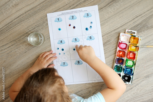 Montessori material. Children's hands. The study of mathematics and seasons. School and kindergarten. early development of children. preparation for school