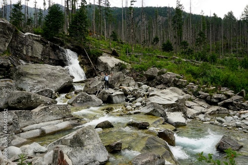 Mountain river and waterfall in High Tatras National Park, Slovakia photo