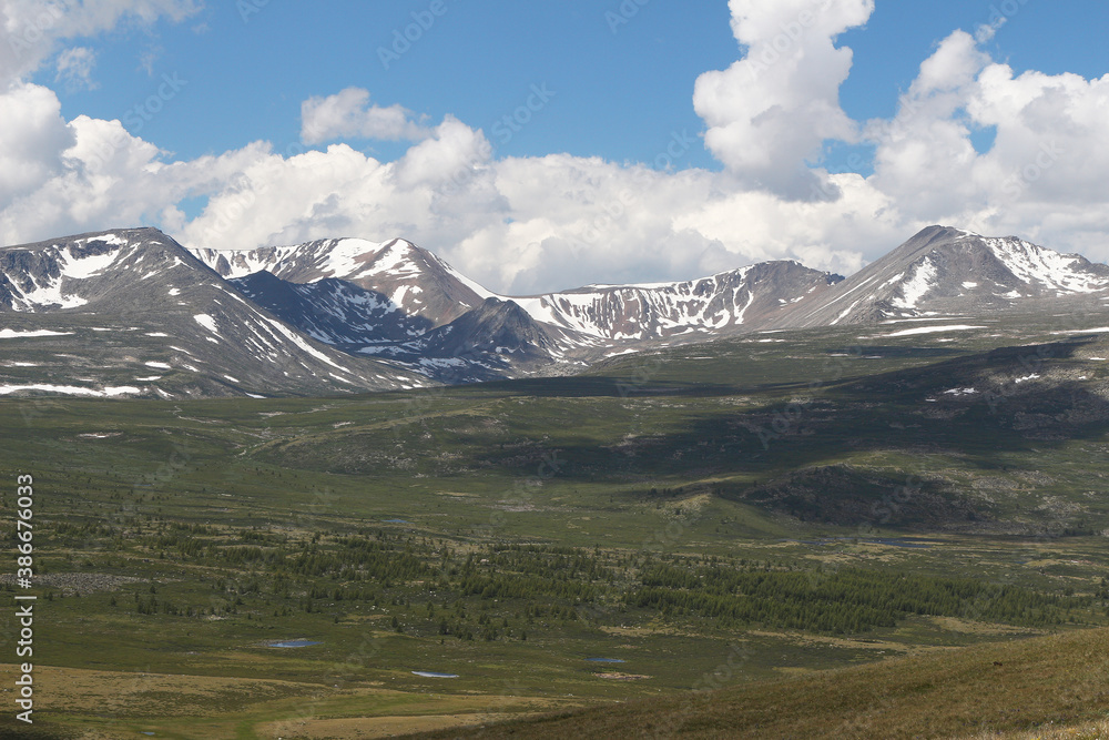 Fototapeta premium mountain landscape of taiga mountains and blue sky