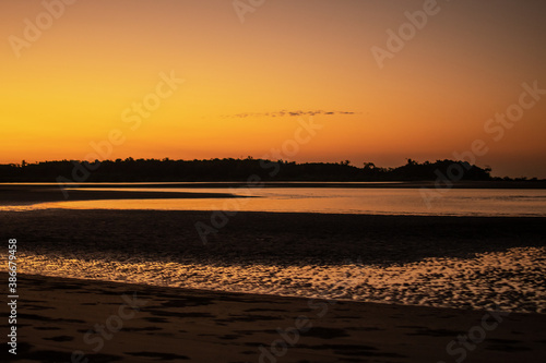 A sand beach during low tide and sunset near Ngwesaung, Myanmar