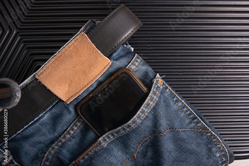 smart phone in blue jean back pocket