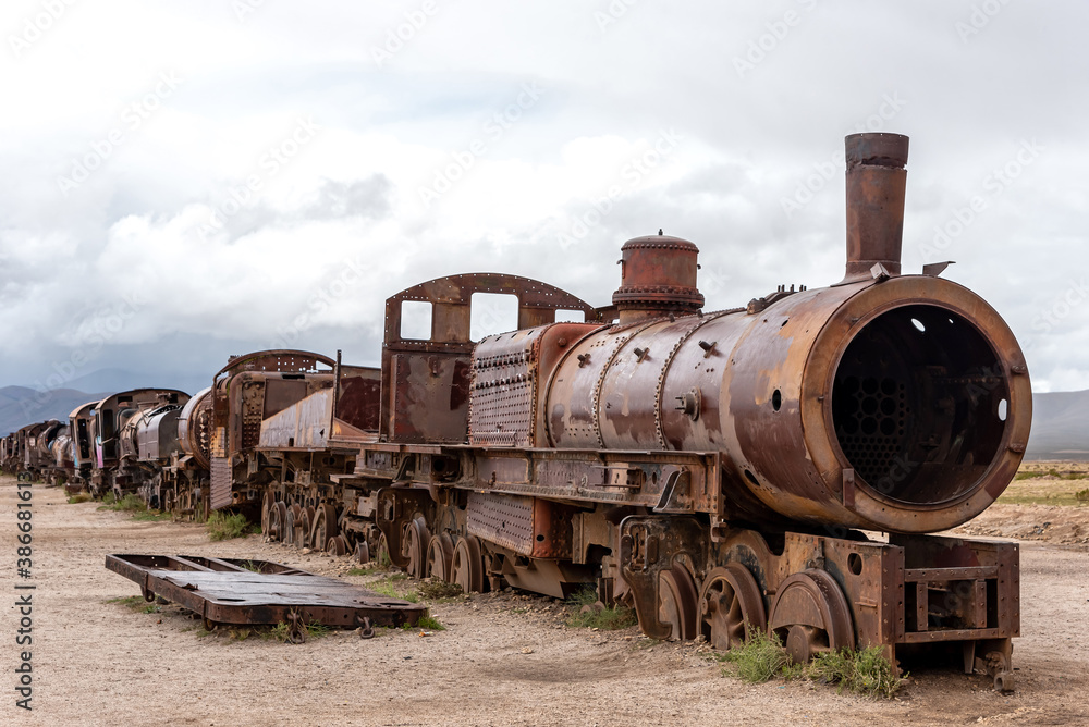 Naklejka premium Old rusty locomotive abandoned in a train cemetery. Uyuni, Bolivia