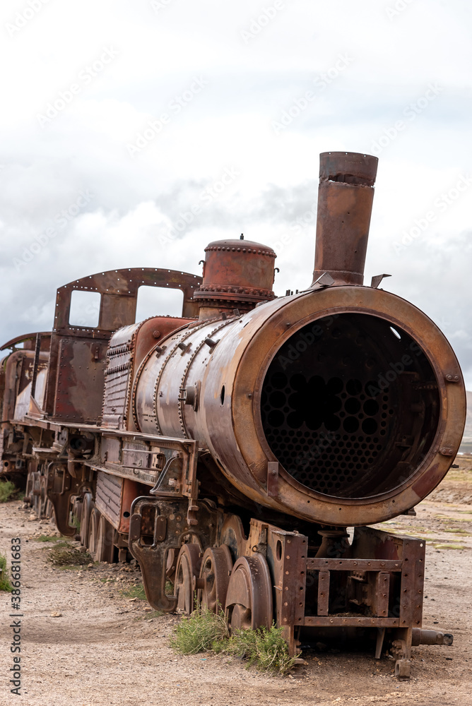 Naklejka premium Old rusty locomotive abandoned in a train cemetery. Uyuni, Bolivia