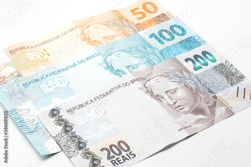 Brazilian money, fifty, one hundred and two hundred real banknote. Front of the real bill, high values, effigy side, real note isolated on white.