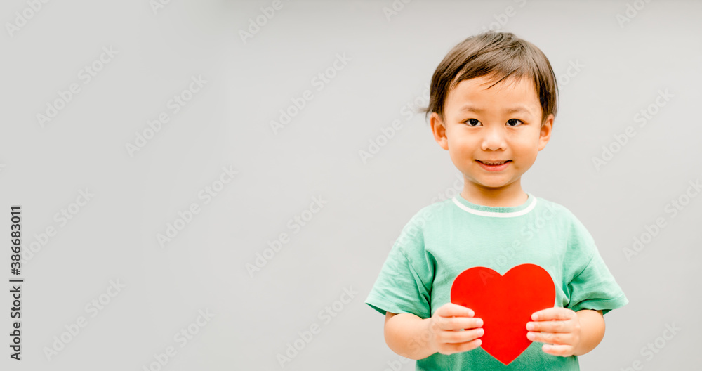 Child hands holding red heart for share Donate.Health care pediatric.family insurance.World heart day, world health day,CSR responsibility, Adoption foster kids.Worship with faith.Banner background. Child hands holding red heart for share Donate.Health care pediatric.family insurance.World heart day, world health day,CSR responsibility, Adoption foster kids.Worship with faith.Banner background.