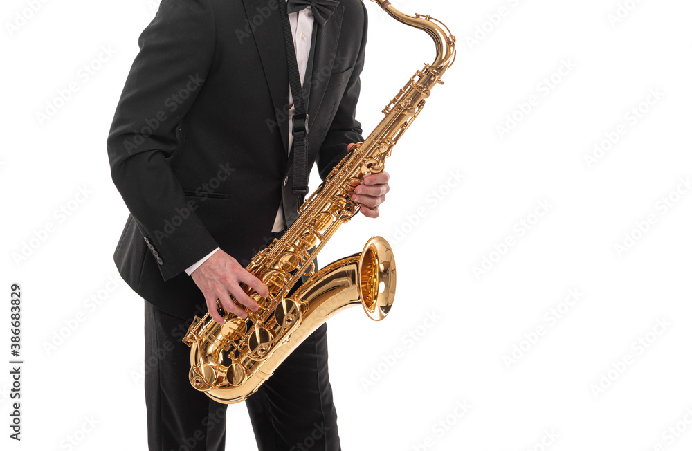 Naklejka premium Saxophonist with a saxophone in his hands on a white background.