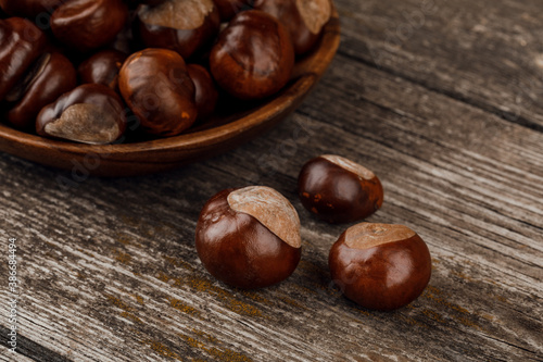 Chestnuts on an old wooden table