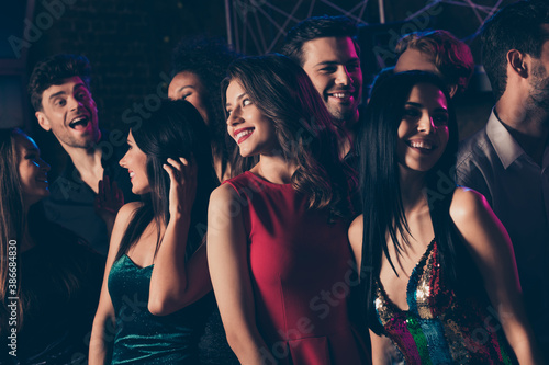 Photo of girl wearing red dress lipstick smiling chilling together dancing with friends in night club on corporate new year party