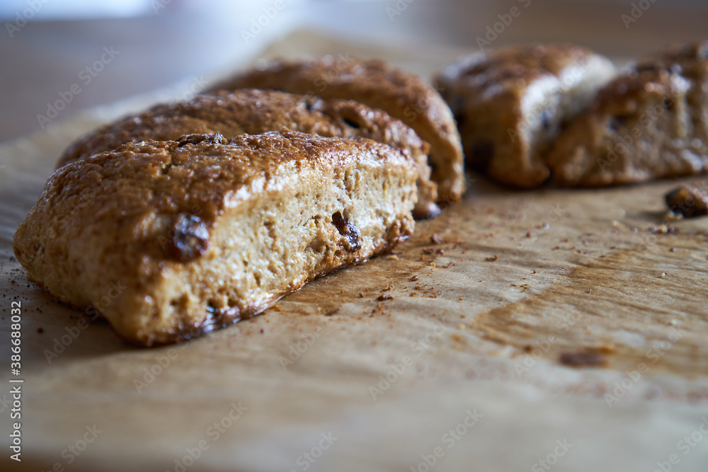 Traditional fresh baked English homemade scones with raisins for breakfast. 