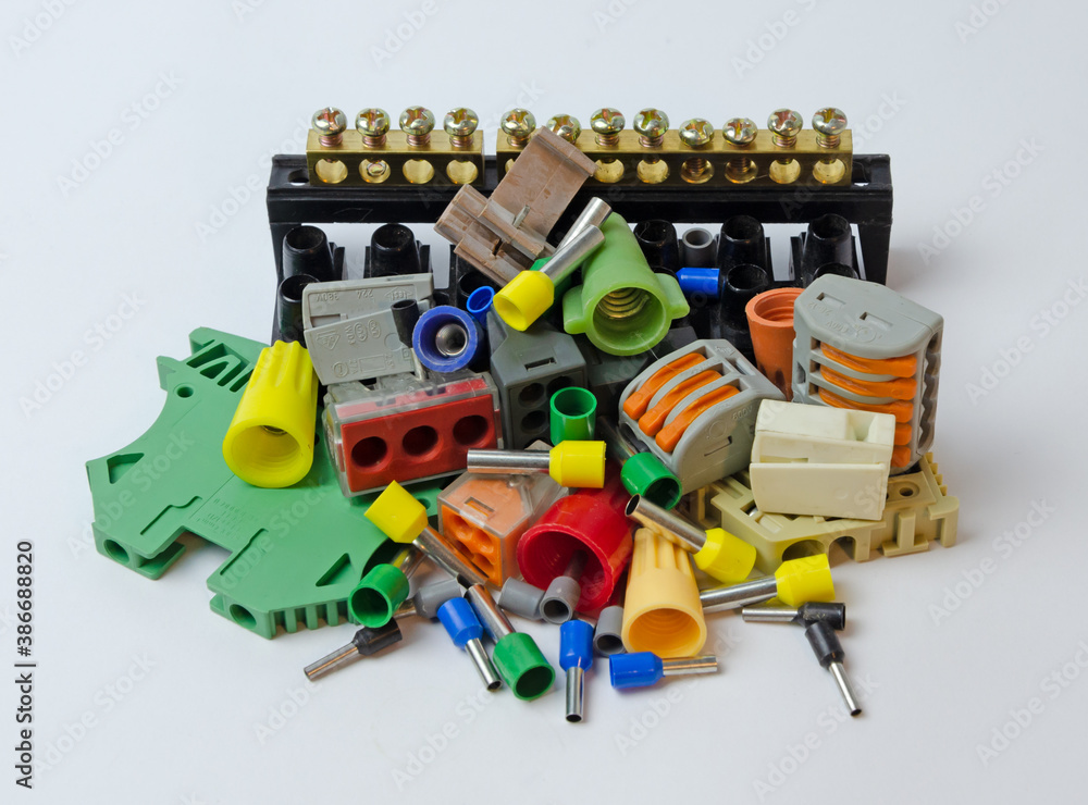 different connectors for electrical wires lie on a white background different connectors for electrical wires lie on a white background