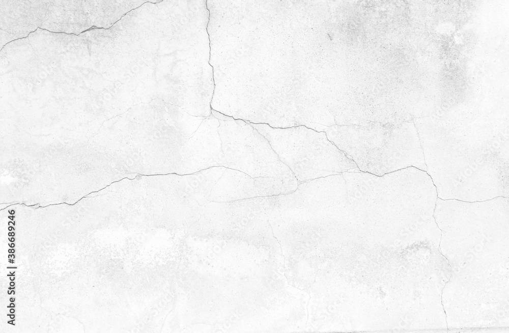 The black and white concept of a plain white plastered brick wall with cracks for backgrounds, patterns and textures for backgrounds. Concrete surfaces are slightly rough. Random seamless wall pattern