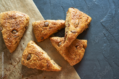 Traditional fresh baked English homemade scones with raisins for breakfast.  photo