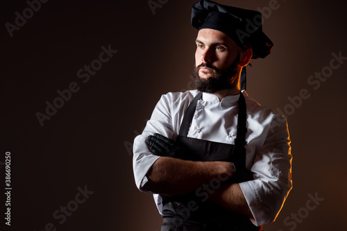 A bearded cook with his arm...