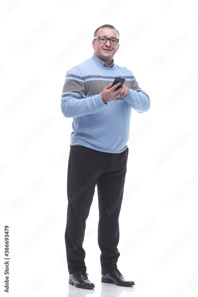 in full growth. attractive mature man with smartphone in full growth. attractive mature man with smartphone