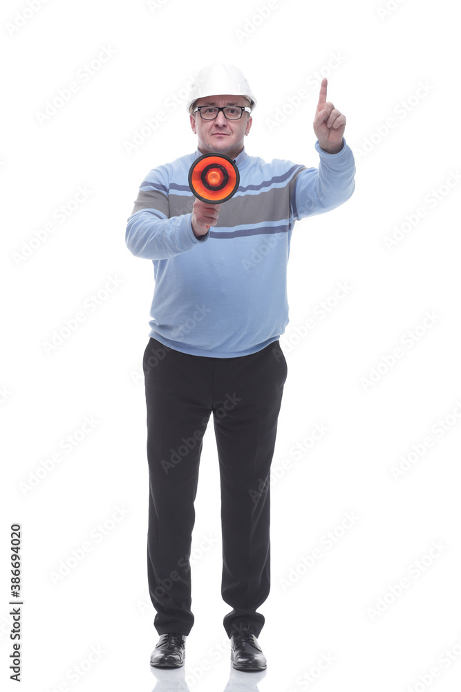 in full growth. Mature man with a megaphone looking at you in full growth. Mature man with a megaphone looking at you