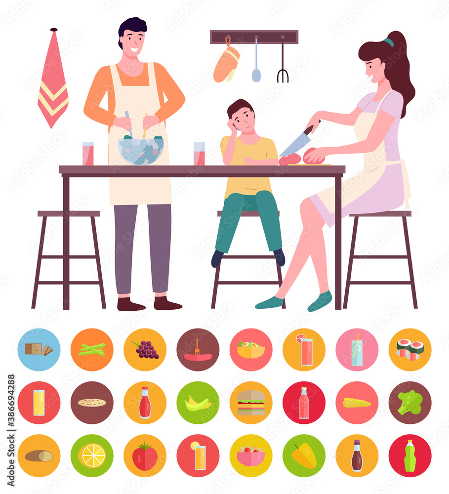 Young mom and dad cooking with son at kitchen, people sitting, standing near kitchen table. Woman cutting tomato, man mixing salad. Collection of different types of food, vegetables, fruits, drinks