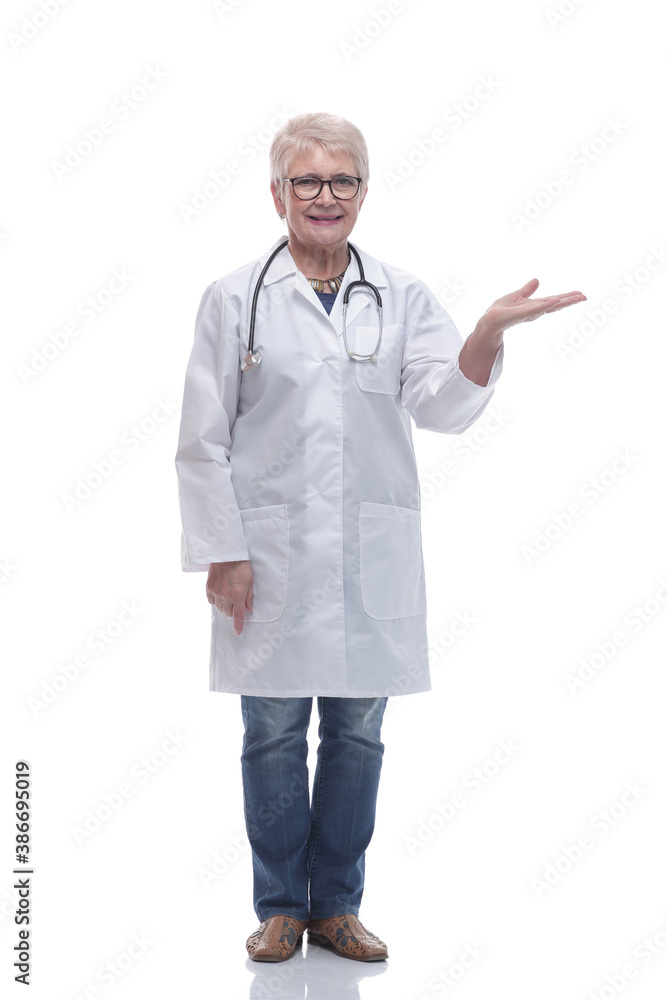 in full growth. smiling woman doctor pointing at a white screen in full growth. smiling woman doctor pointing at a white screen