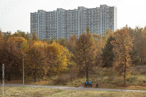 High-rise building in the autumn forest