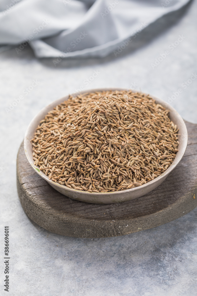 Cumin or caraway seeds on white background. Top view Cumin or caraway seeds on white background. Top view