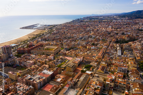 Picturesque aerial view of winter cityscape of Mataro on Mediterranean coast, Costa del Maresme, Spain photo