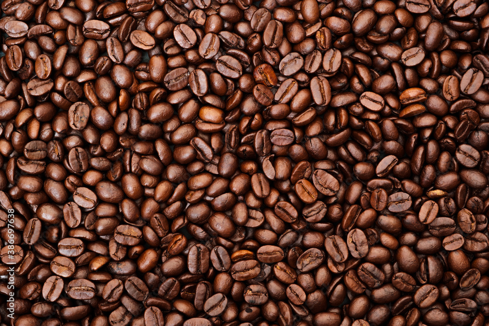 Top view of brown roasted coffee beans, can be use as background, copy space for text. Top view of brown roasted coffee beans, can be use as background, copy space for text.