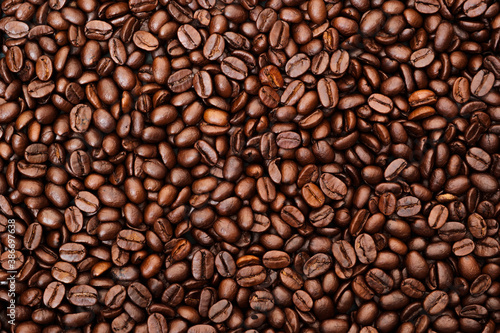 Top view of brown roasted coffee beans  can be use as background  copy space for text.