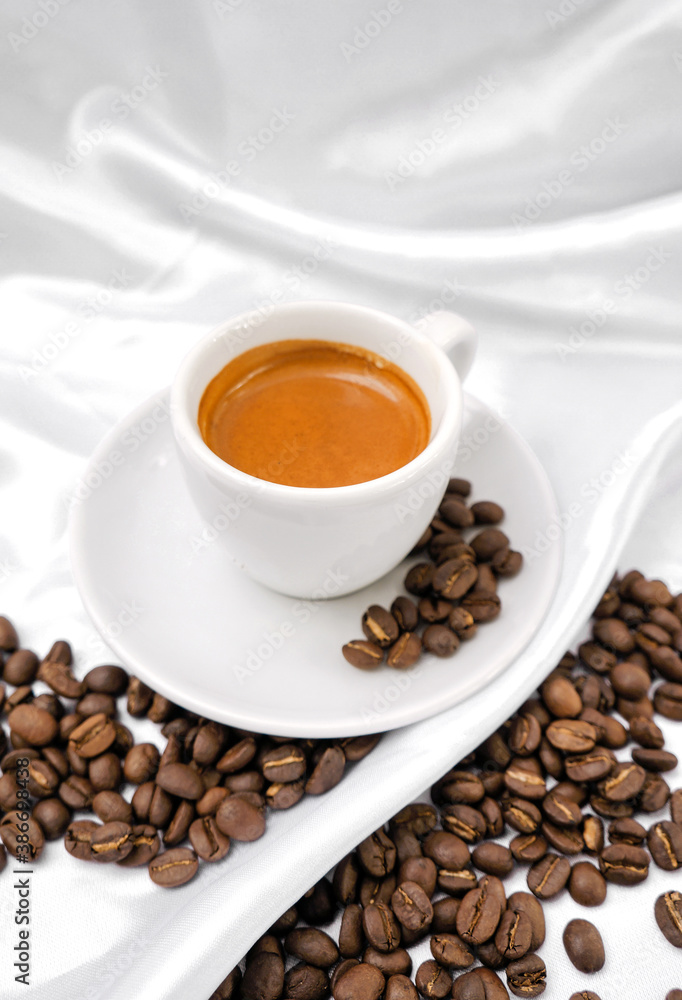 Espresso coffee and coffee beans on a white background Espresso coffee and coffee beans on a white background