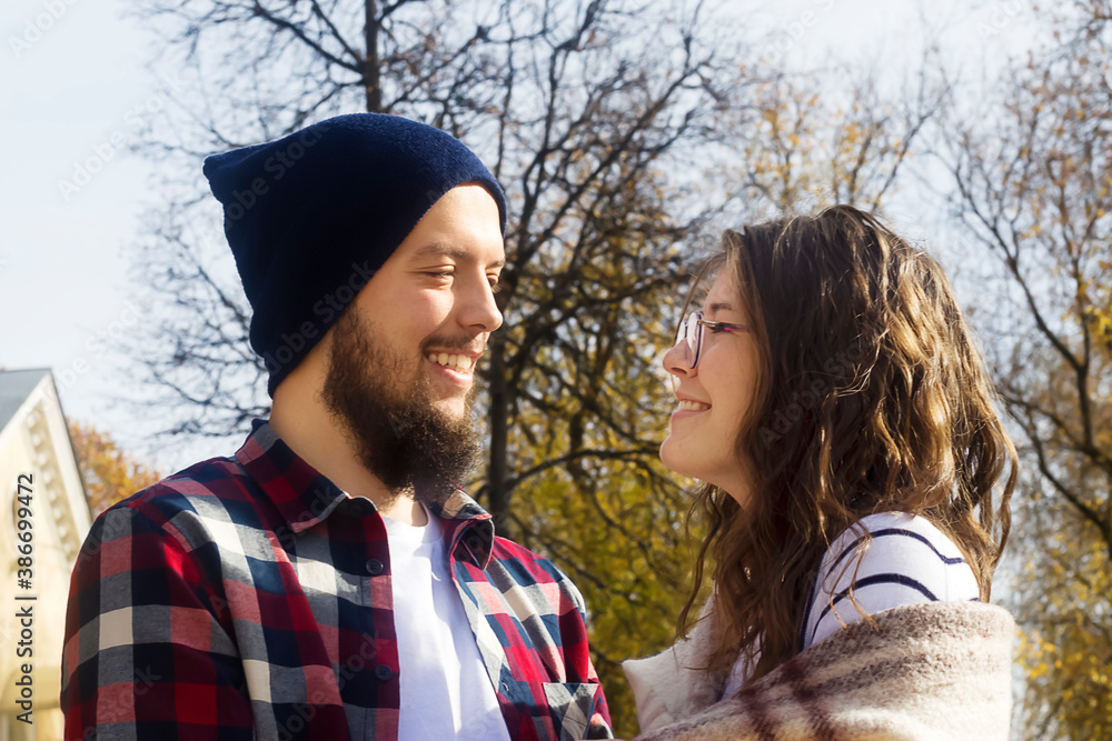 Fototapeta premium a guy and a girl look at each other and smile