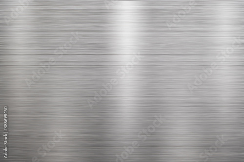 Silver metal texture of brushed stainless steel plate with the reflection of light.