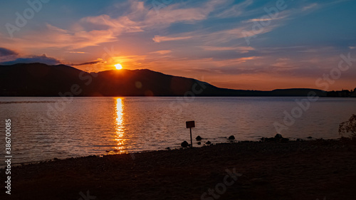 Beautiful alpine sunset view with reflections at the famous Tegernsee, Bavaria, Germany