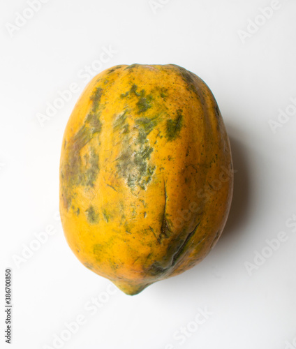Riped papaya with closeup view, isolated, white background.  photo