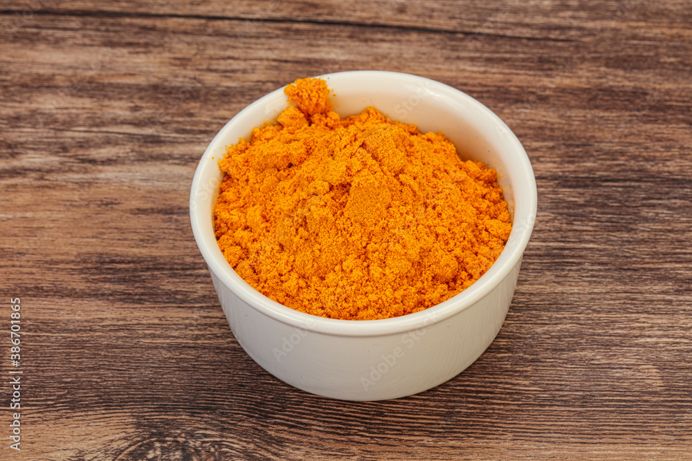 Tumeric powder in the bowl Tumeric powder in the bowl