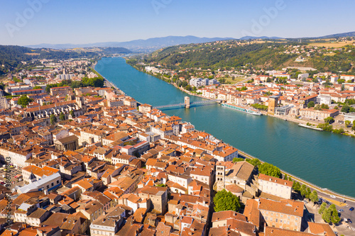 Picturesque view from drone of river Rhone and French city of Vienne in summer, Isere department.