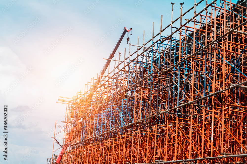 Fototapeta premium scaffolding with crane in construction site